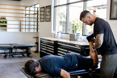 A chiropractor at Crux Sport & Spine in St. George, Utah performs a foot and ankle adjustment on a patient.